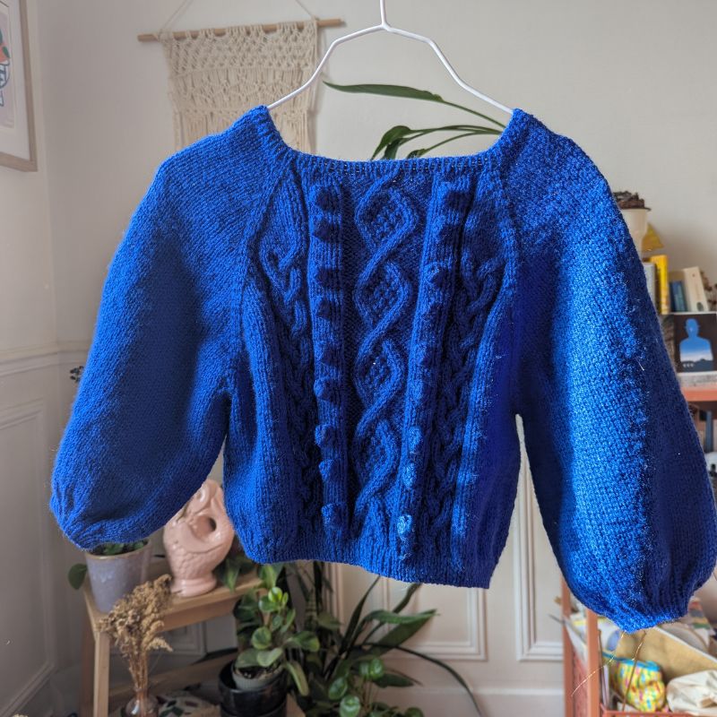 Twist and Shout cardigan with simple cable detail on the back, perfect for kids
